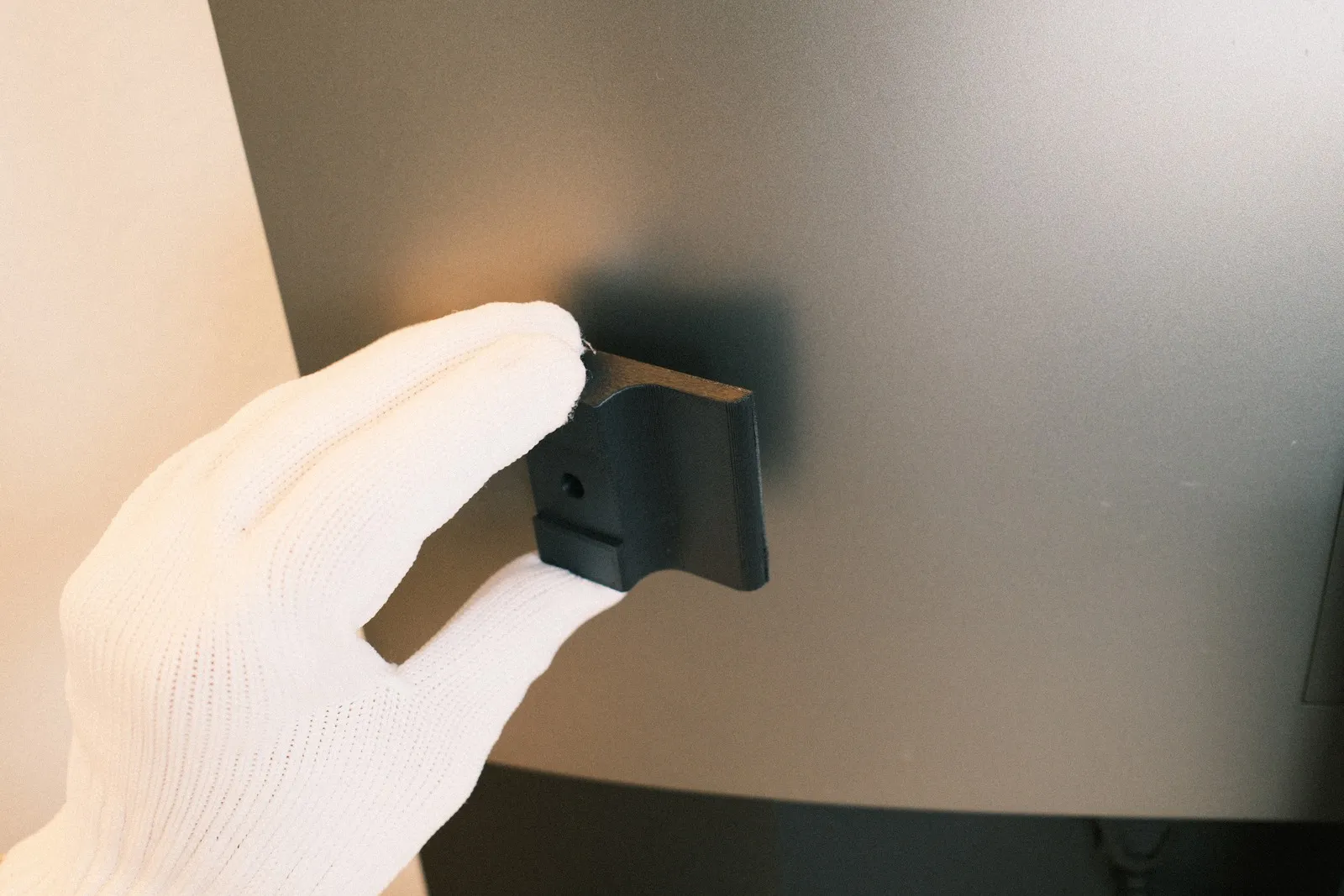 Sticking the 3M mount to the back of the monitor