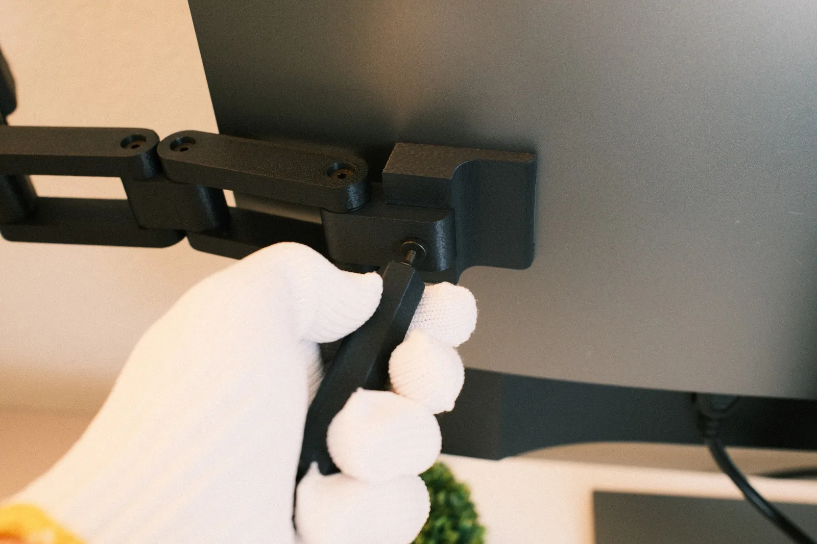 Attaching the arm onto the mount with included tool