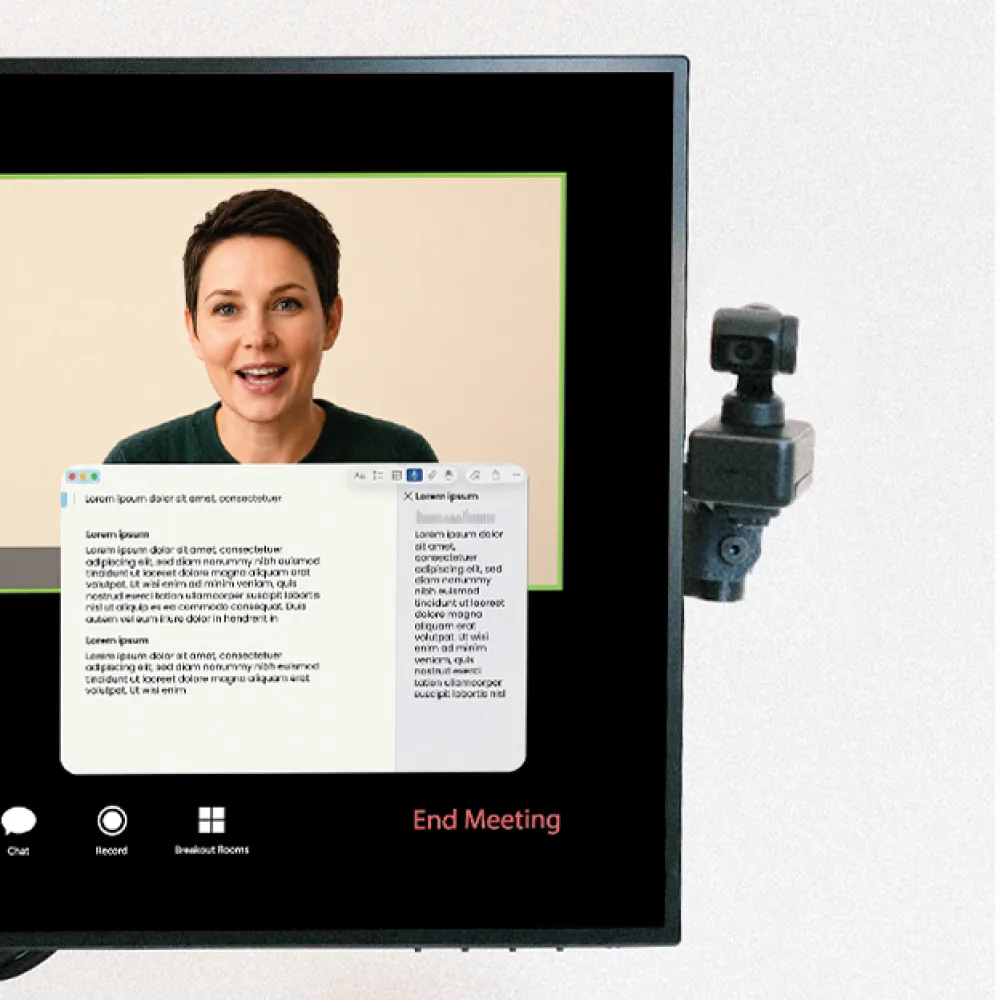 Camera swung fully out beside the monitor — screen completely clear