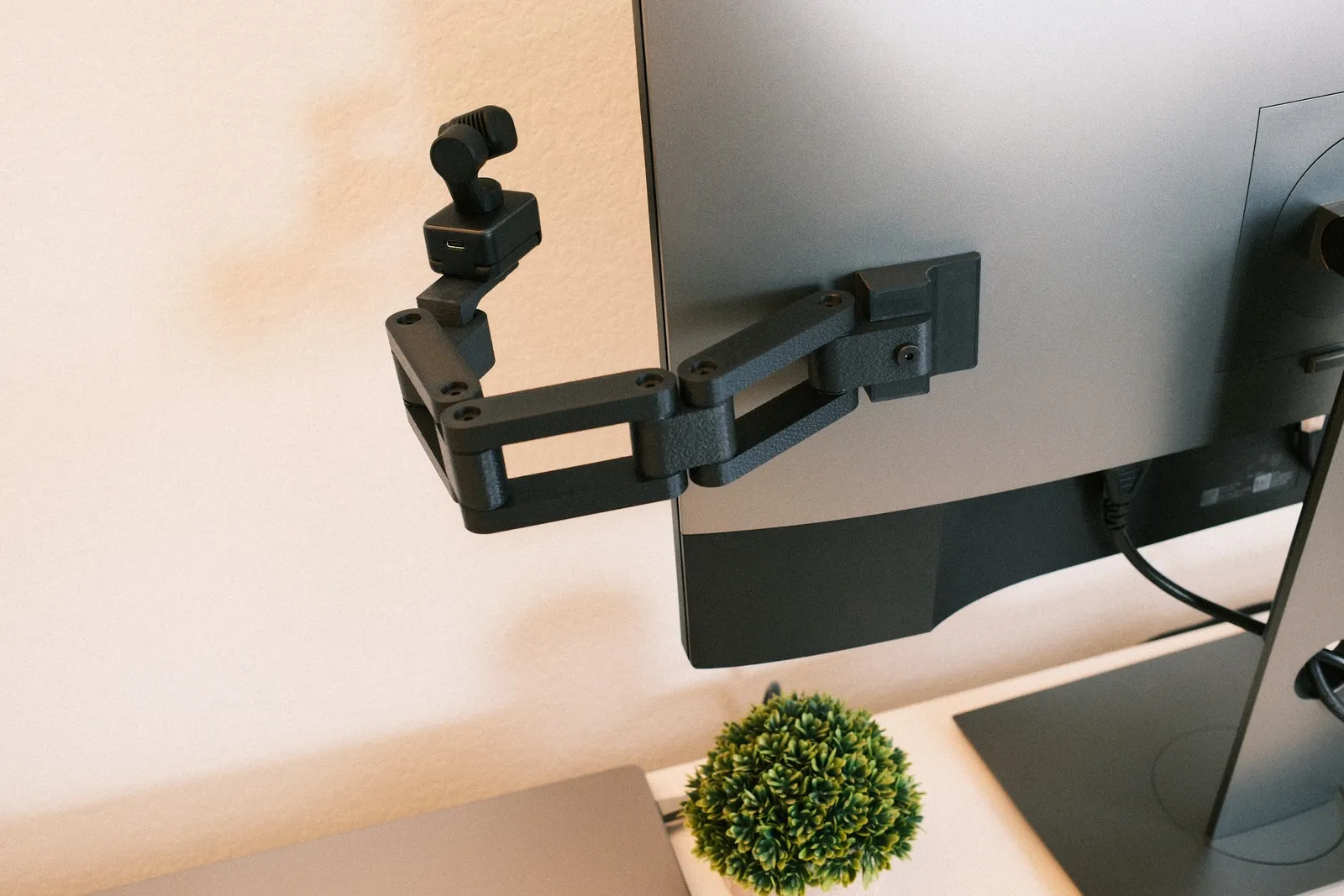 Back view of the 3-link Calibra arm mounted with 3M adhesive